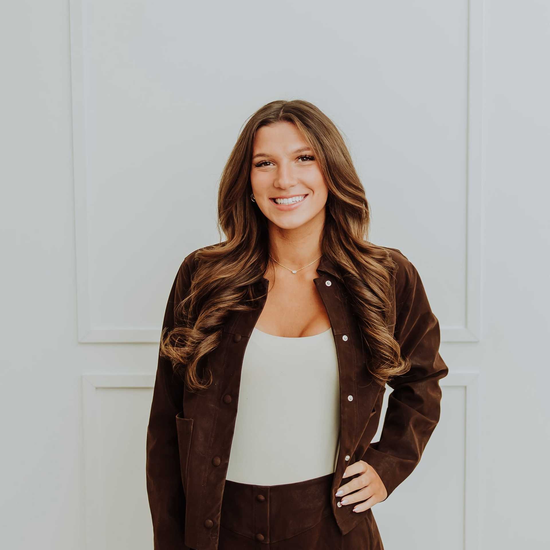 Portrait of Mady, a professional stylist at Bombshell Salon & Spa, showcasing their expertise and style.
