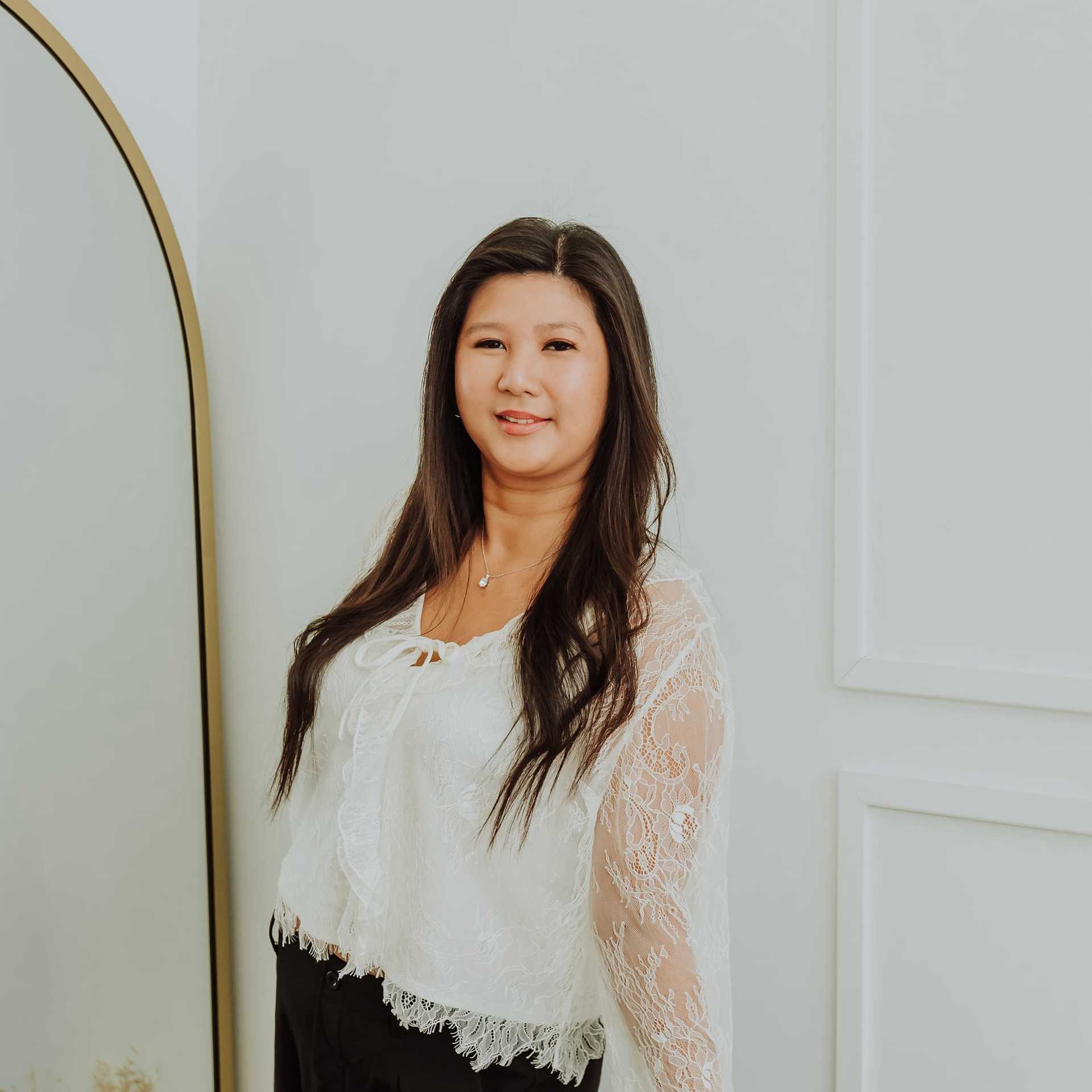 Portrait of Silvia, a professional stylist at Bombshell Salon & Spa, showcasing their expertise and style.