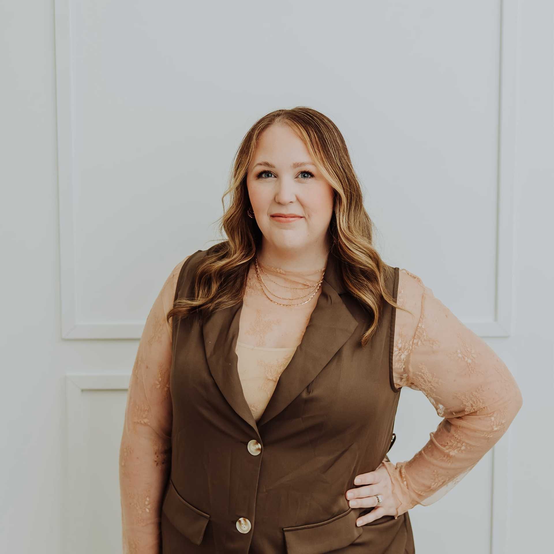 Portrait of Megan, a professional stylist at Bombshell Salon & Spa, showcasing their expertise and style.
