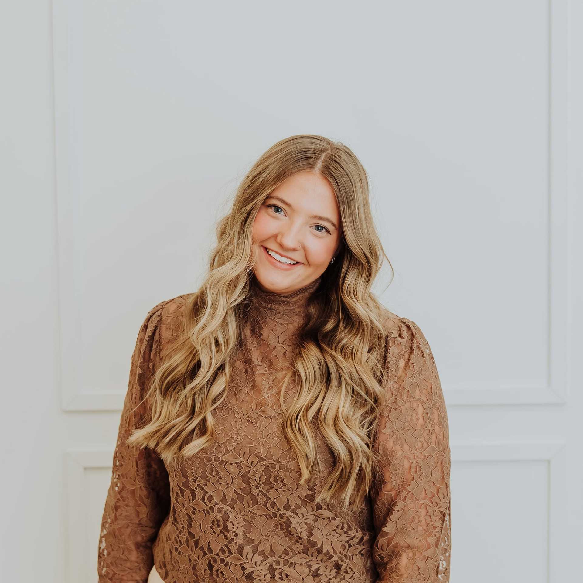 Portrait of Katie, a professional stylist at Bombshell Salon & Spa, showcasing their expertise and style.