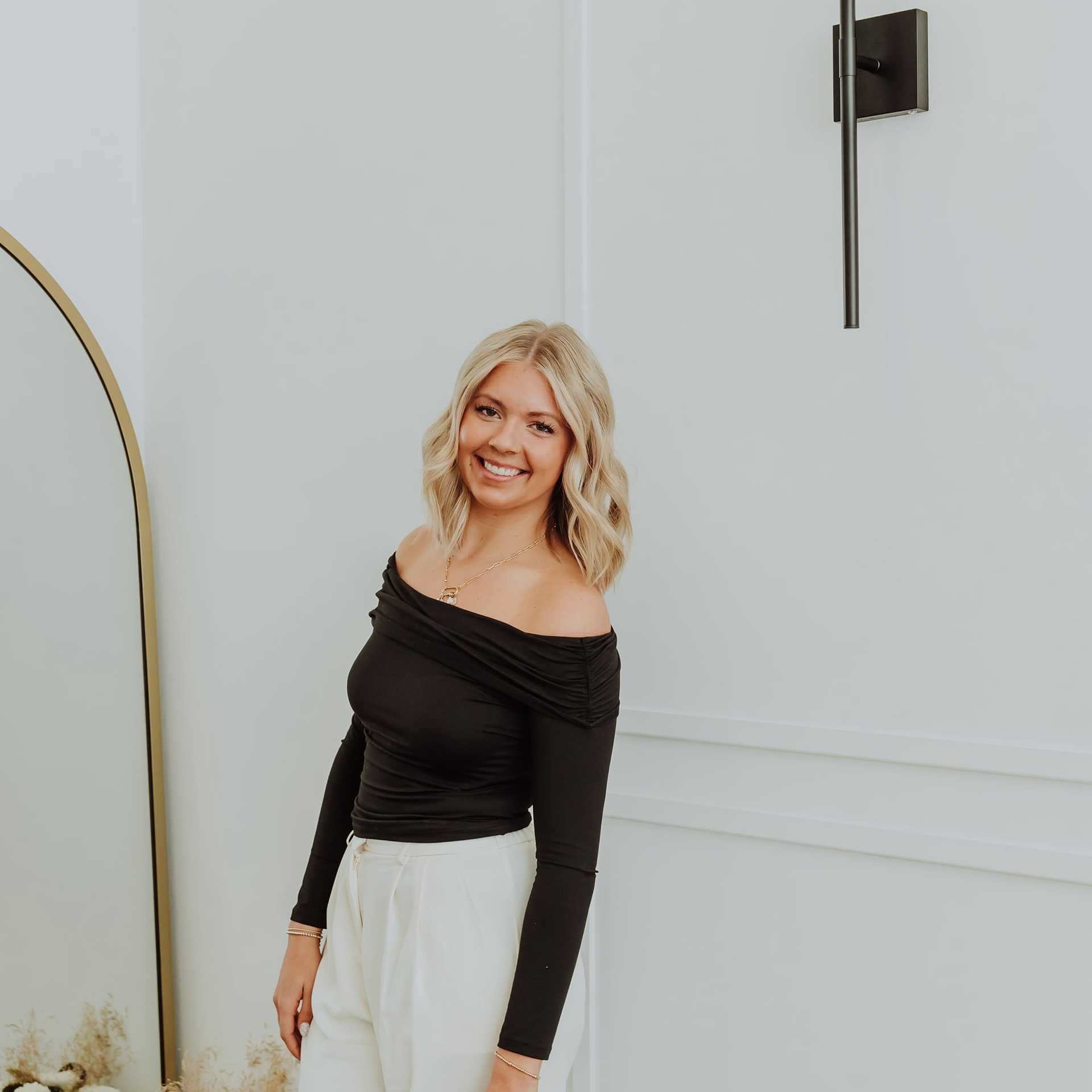 Portrait of Lexi K., a professional stylist at Bombshell Salon & Spa, showcasing their expertise and style.