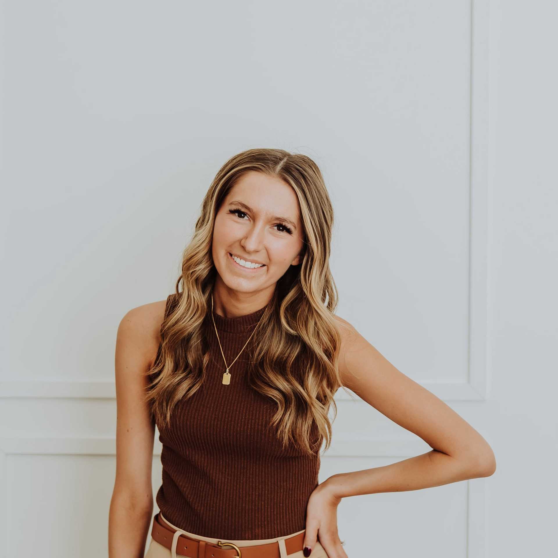 Portrait of Corrine, a professional stylist at Bombshell Salon & Spa, showcasing their expertise and style.