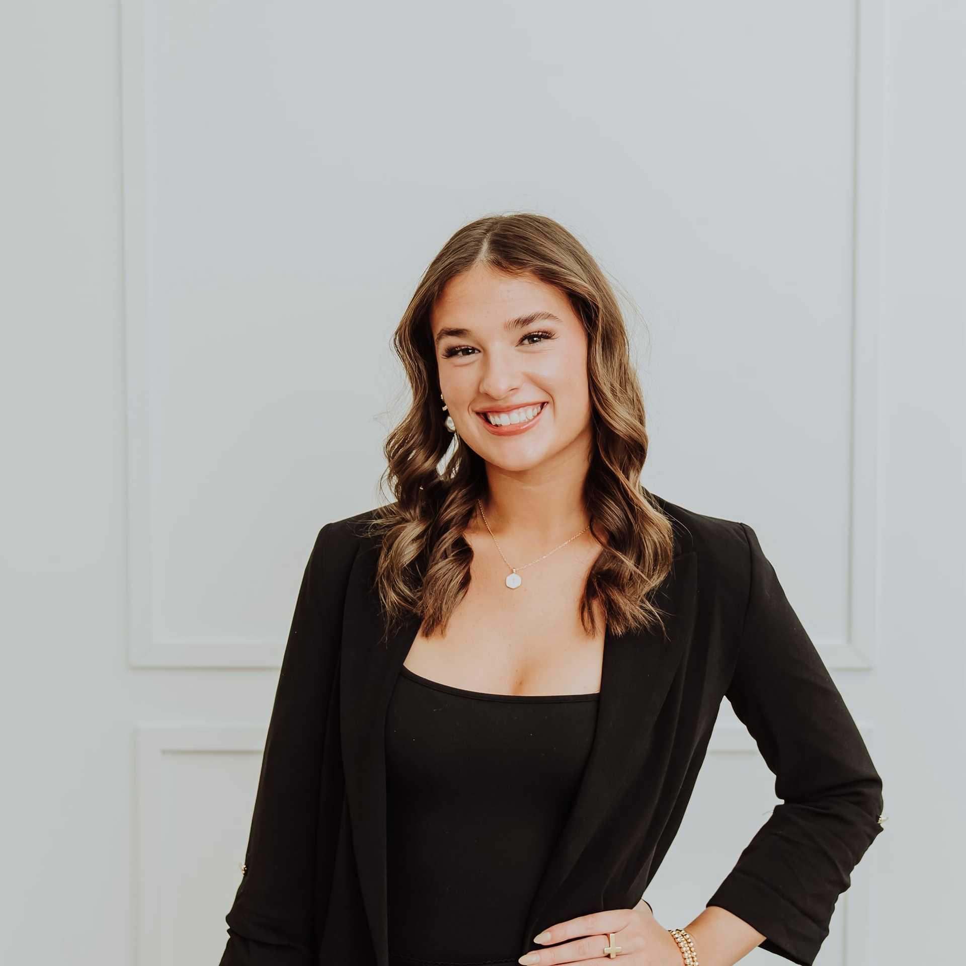 Portrait of Isabel, a professional stylist at Bombshell Salon & Spa, showcasing their expertise and style.