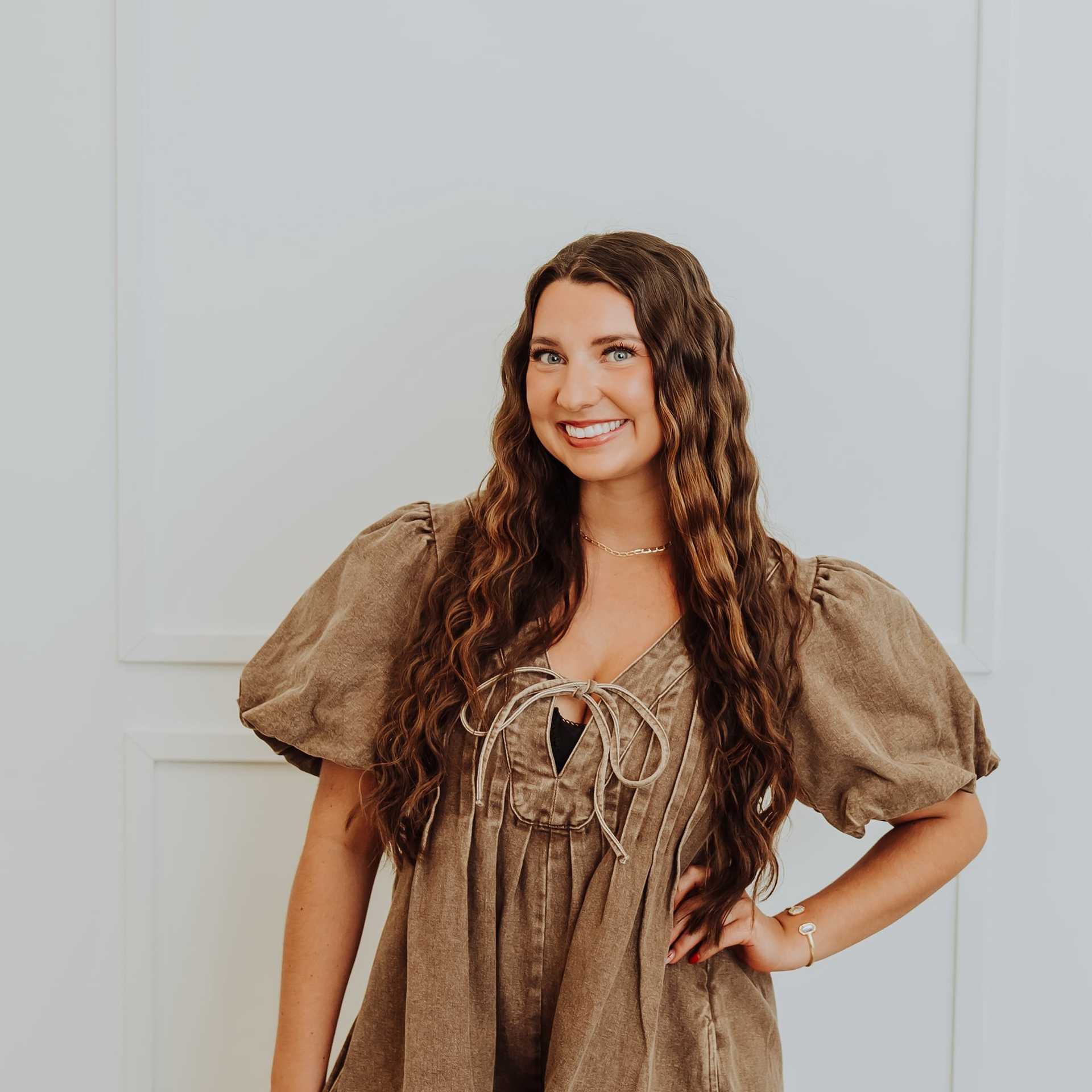 Portrait of Remington, a professional stylist at Bombshell Salon & Spa, showcasing their expertise and style.